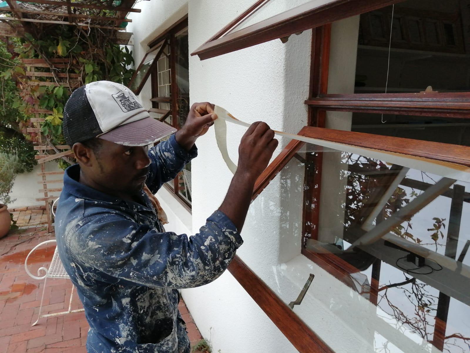 Keith Quality team carefully masking window trim